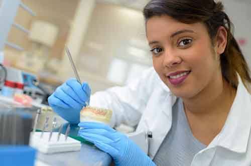 a dental technician working on creating new dentures